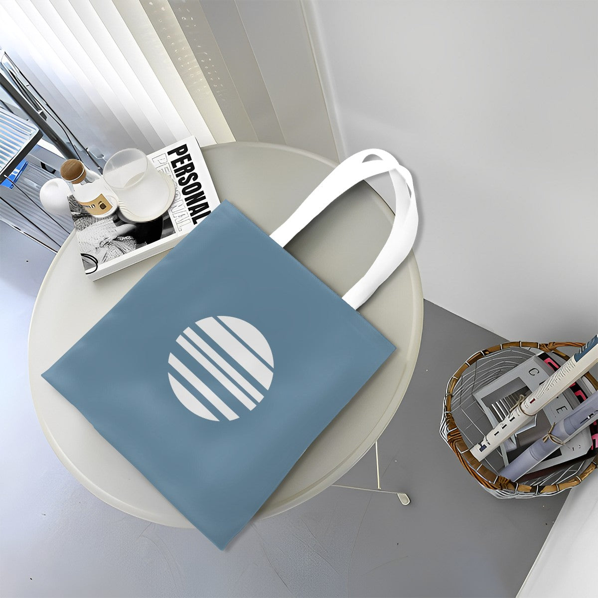 Blue tote bag with white handle on a round table