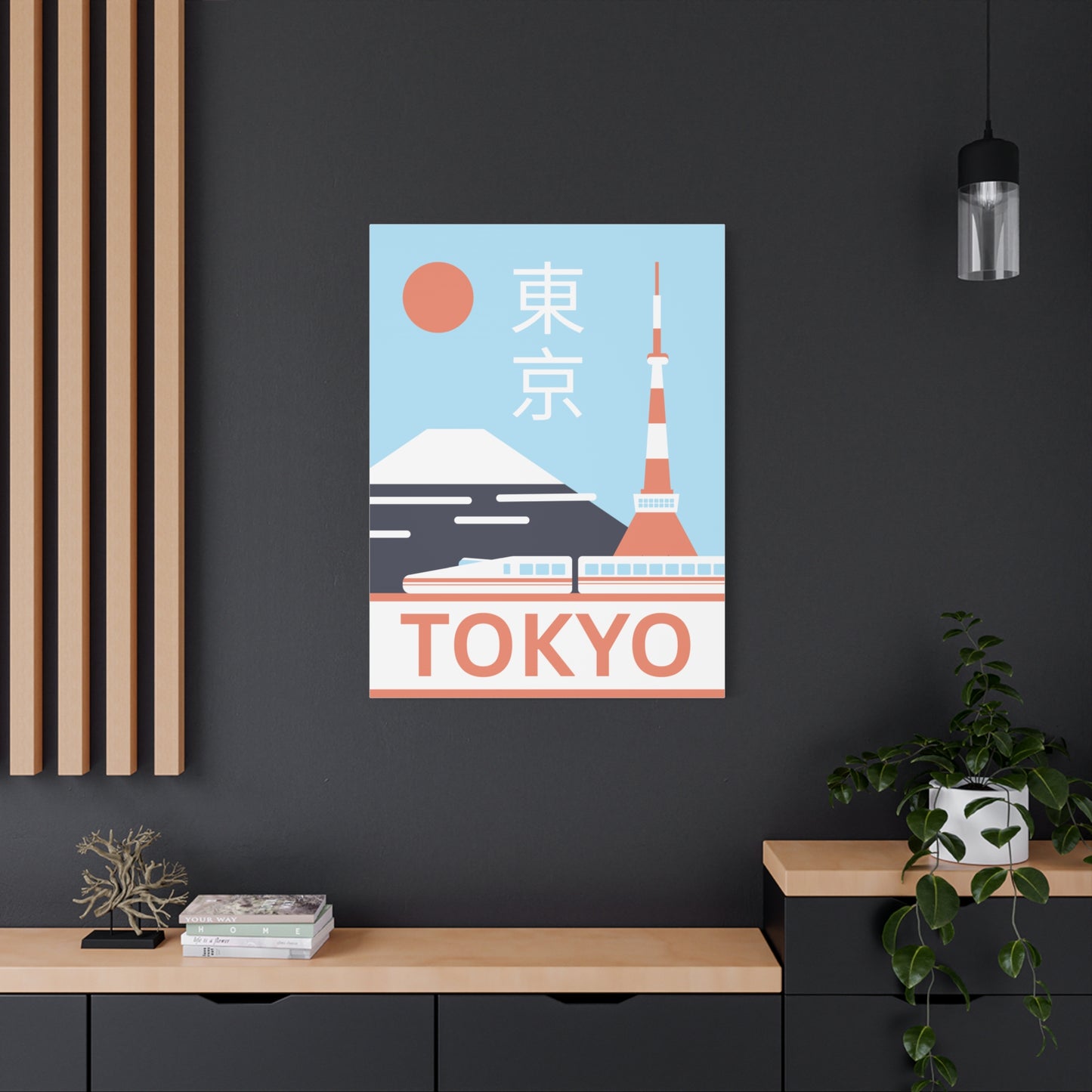 Framed poster of Tokyo with Mount Fuji and the Tokyo Tower on a dark wall.