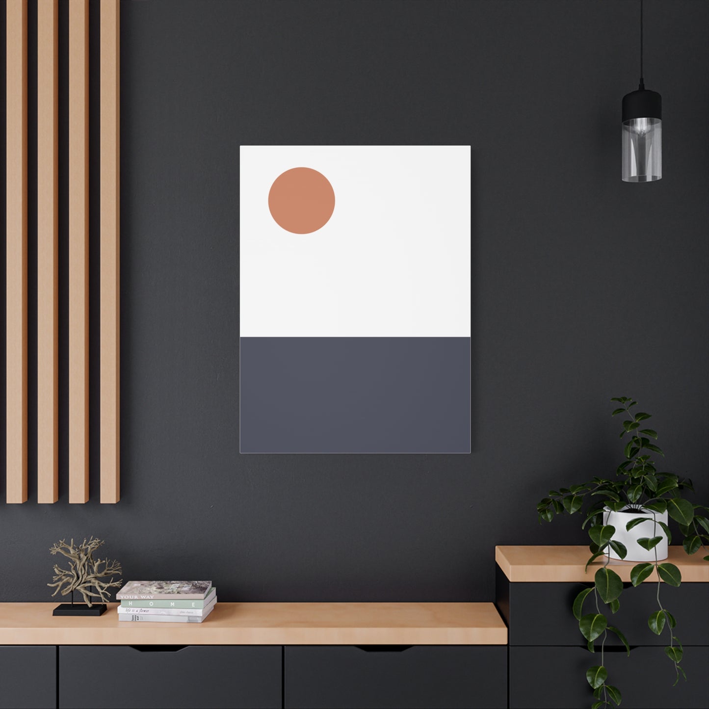 Modern interior with a minimalistic abstract art piece on a dark wall.