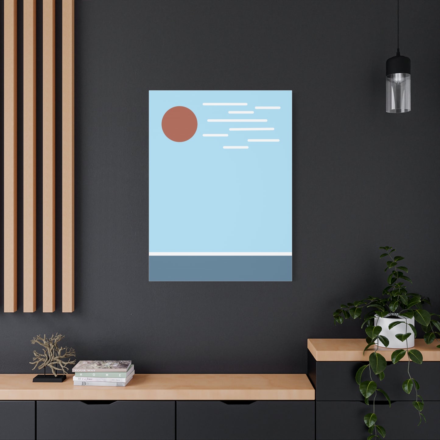Modern interior with a framed abstract artwork on a dark wall.