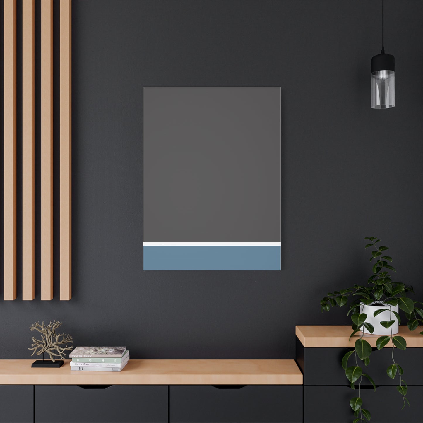 Modern interior with a rectangular wall art piece on a dark gray wall.