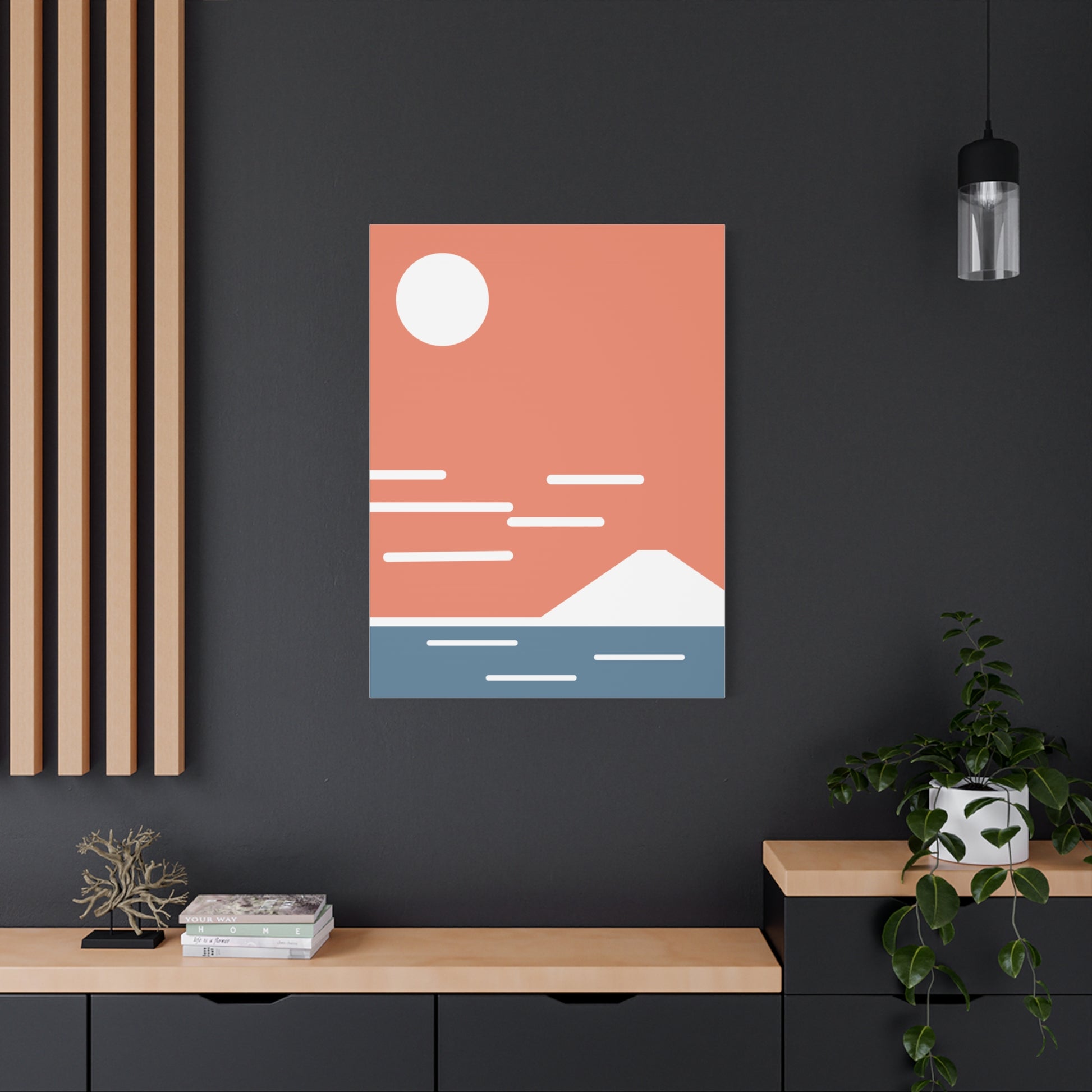 Framed abstract art piece on a dark wall with minimal decor.