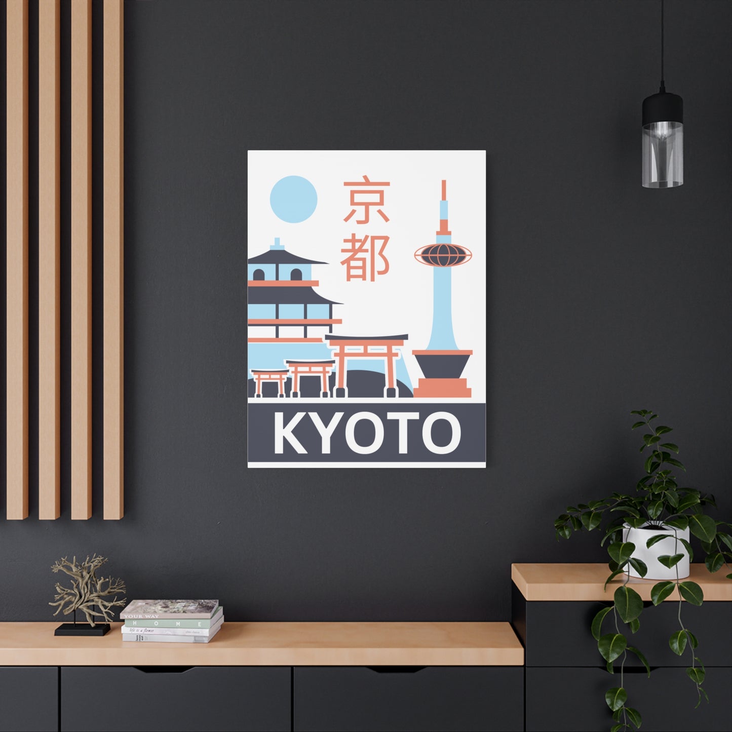 Framed poster of Kyoto with traditional Japanese architecture on a dark wall.