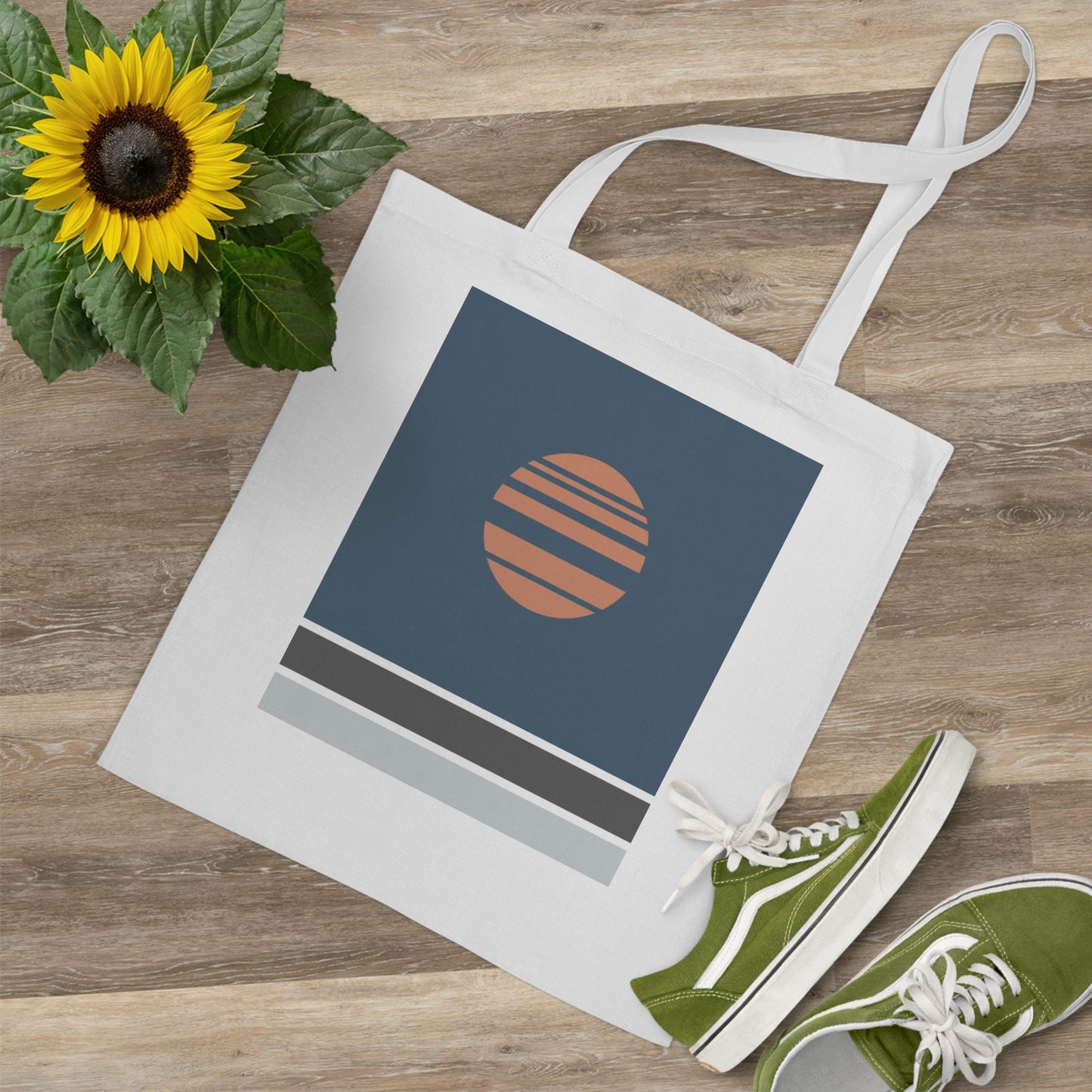 Tote bag with a sunflower design on a wooden surface
