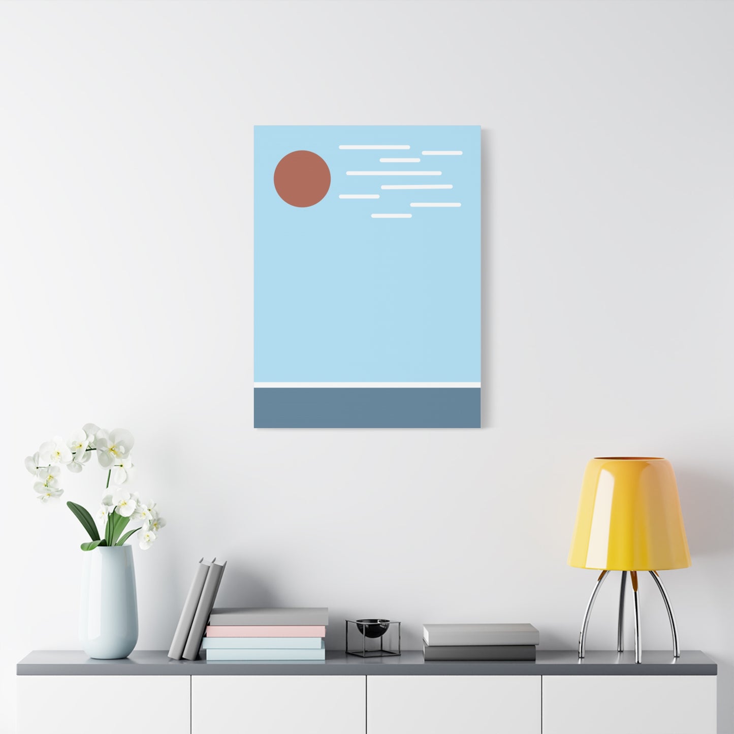 Abstract art print on a wall above a shelf with decor items.