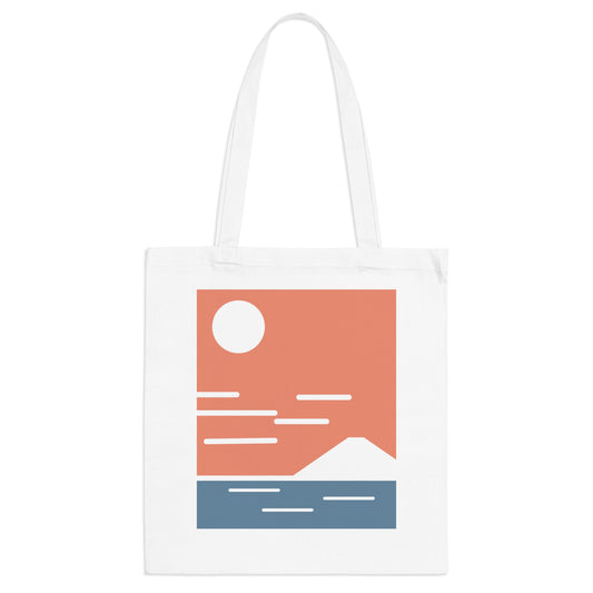 White tote bag with a minimalist landscape design featuring a mountain, lake, and sun on a white background.