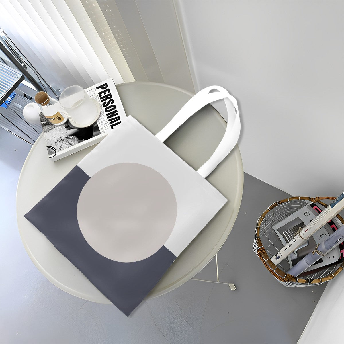 White tote bag with a gray circle design on a round table.