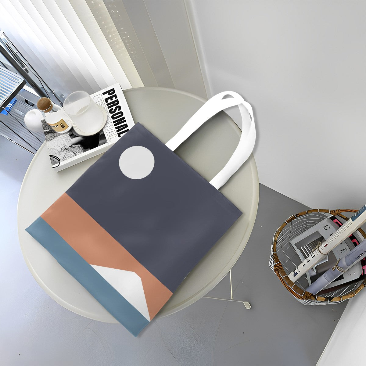 Colorful tote bag on a round table with a magazine and small items.