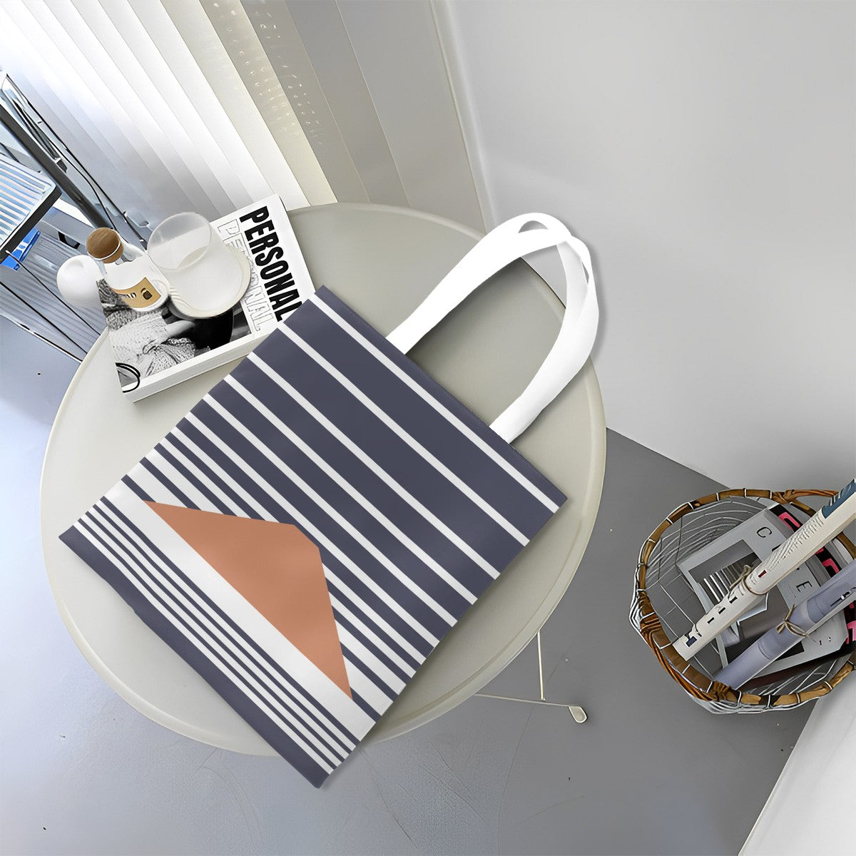 Striped tote bag with geometric design on a round table