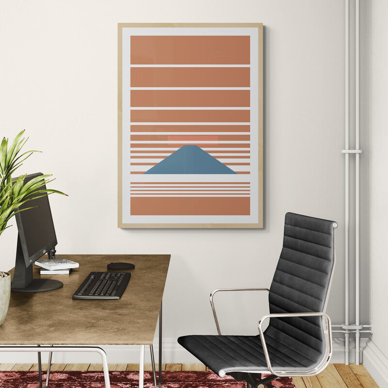 Sofa with decorative pillows and a wall art piece in a living room setting