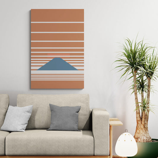 Sofa with decorative pillows and a wall art piece in a living room setting