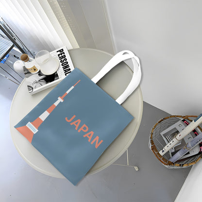 Blue tote bag with 'Japan' text on a round table