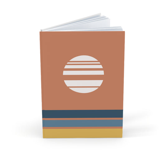 Notebook with a brown cover featuring a white circular design and blue and gold stripes on a white background