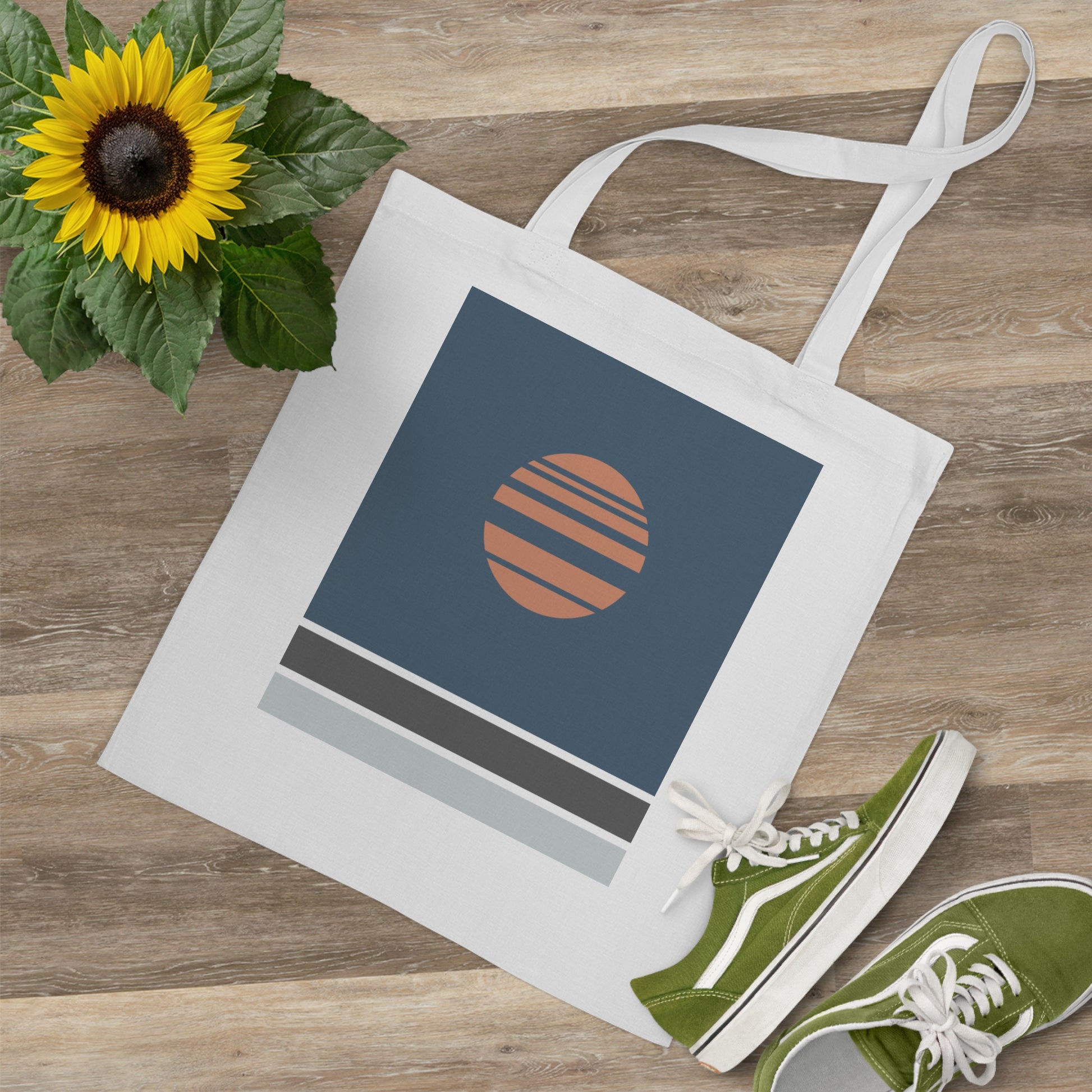Tote bag with a sunflower design on a wooden surface