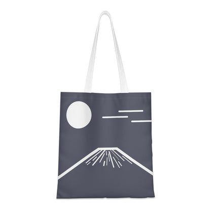Tote bag with minimalist design of a moon and mountain on a dark background