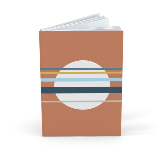 Notebook with a brown cover featuring a circular design with horizontal stripes on a white background