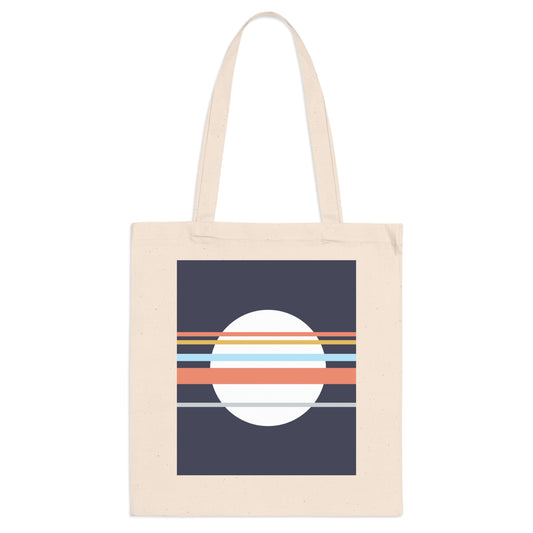 Beige tote bag with a geometric design featuring a white circle and orange stripes on a navy background.