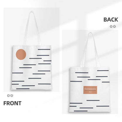 White tote bag with black patterns and a brown circle on the front, and 'Konseptu' logo on the back.