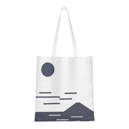Tote bag with a minimalist design of a mountain, sun, and clouds on a white background