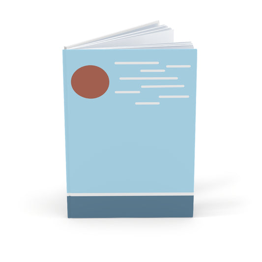 Notebook with a blue cover, brown circle, and white text on a white background
