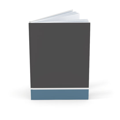 Notebook with a dark gray cover and blue bottom section on a white background