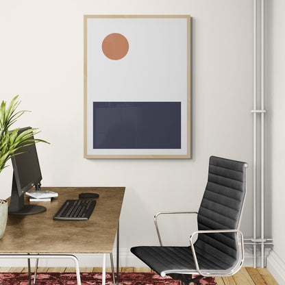 Modern office setup with a desk, chair, and framed abstract art on the wall.
