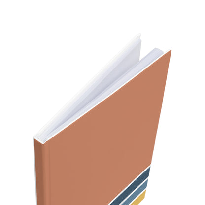 Brown book with a white cover on a white background