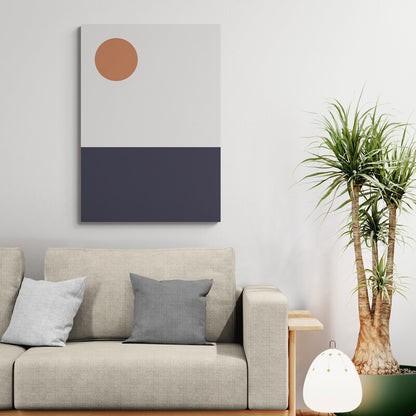 Modern living room with a beige sofa, decorative pillows, a plant, and a wall art piece.