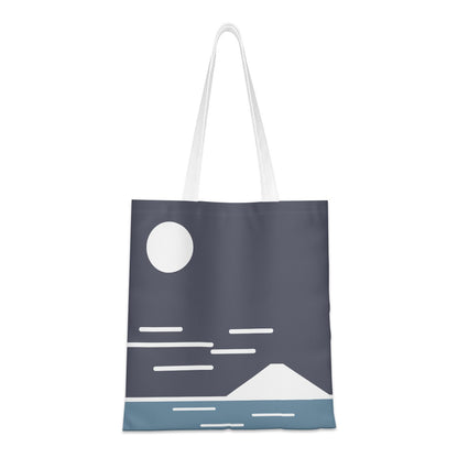 Tote bag with a minimalist design of a moon, stars, and mountain on a dark blue background.