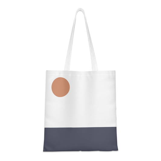 Tote bag with a brown circle and navy bottom section on a white background