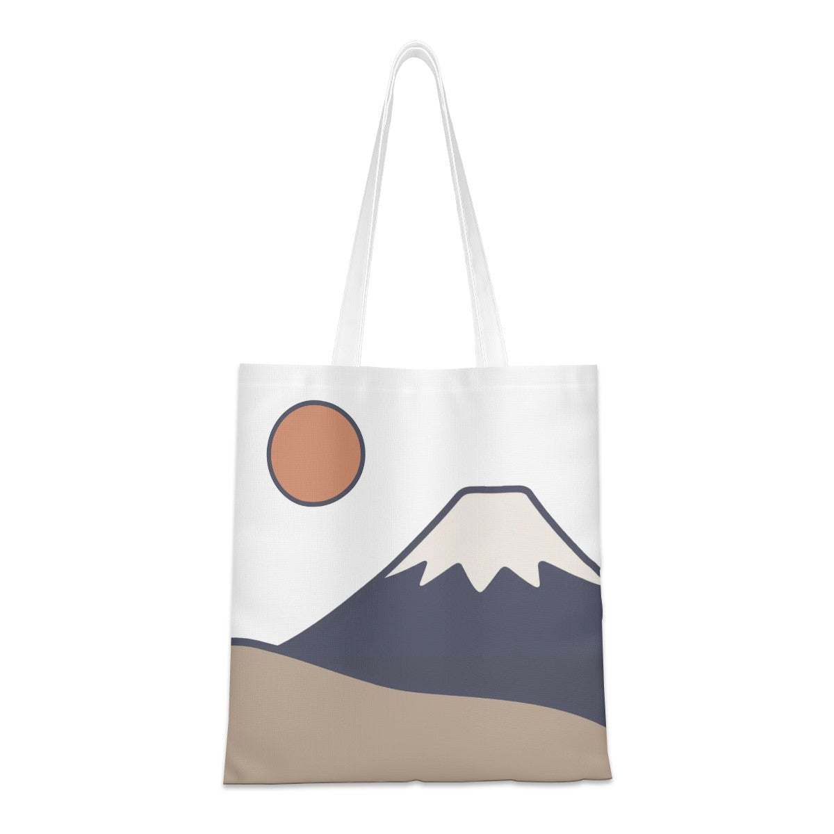A white canvas tote bag featuring a minimalist graphic print of a mountain, a sun, and a sandy ground in muted blue, beige, and terracotta colors.